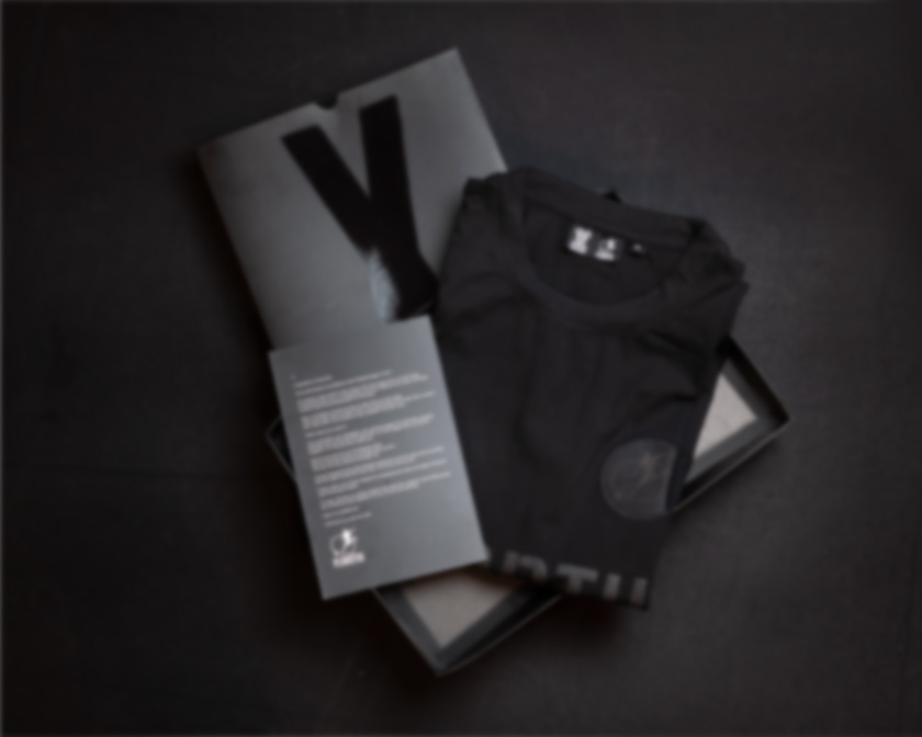 Plaantik 10 Year Commemorative Blackout Unisex Tee - Image 4