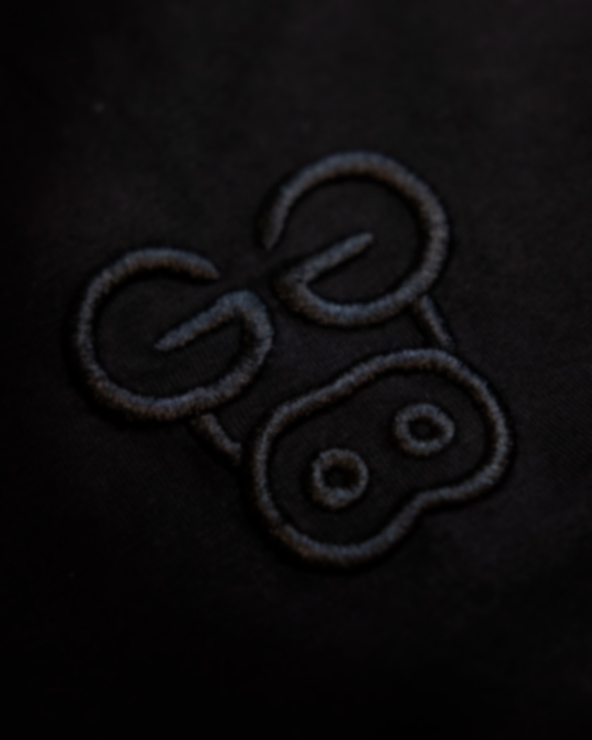 Plaantik 10 Year Commemorative Blackout Unisex Tee - Image 9